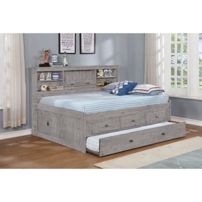 Twin bed with shelving unit and trundle